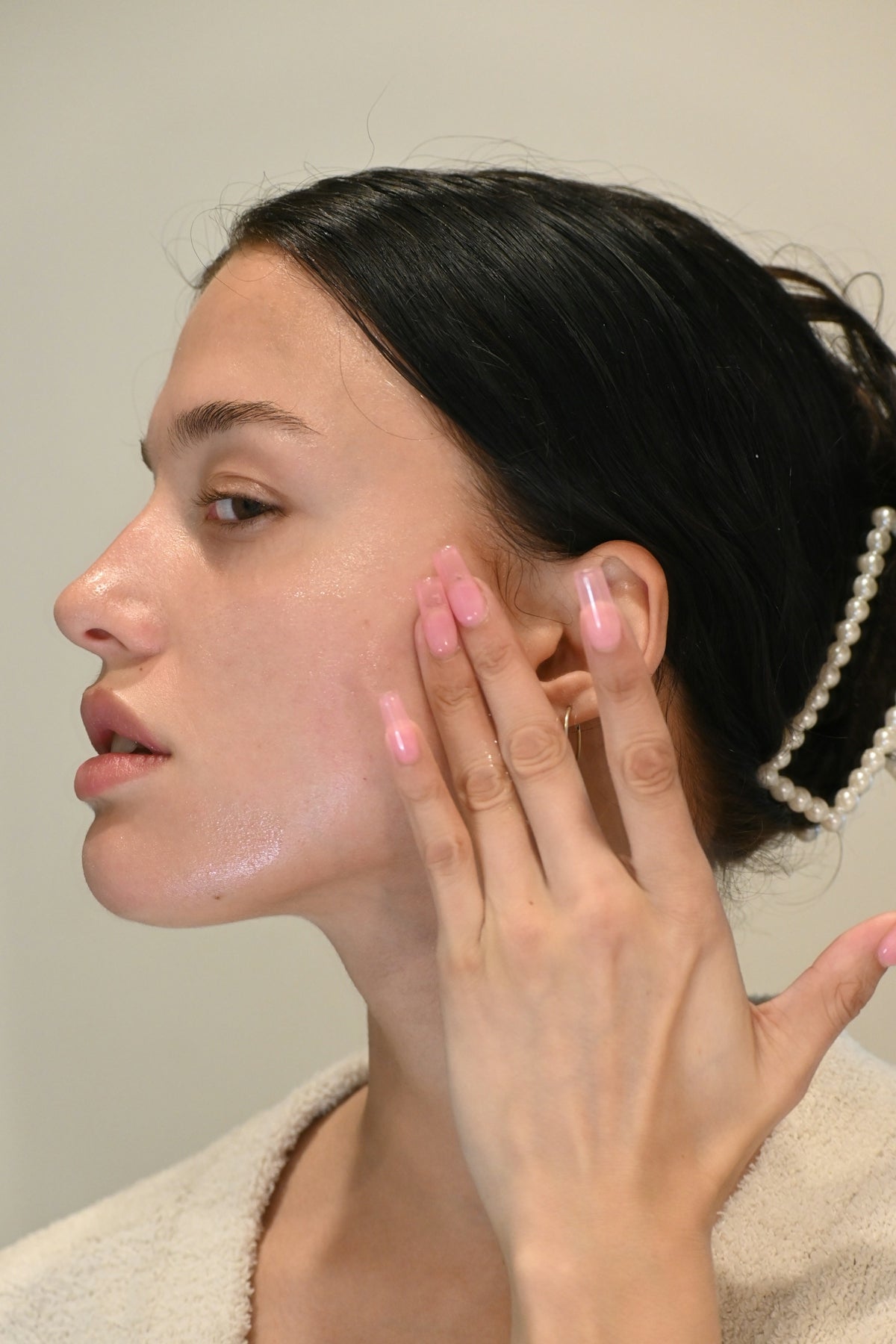 a woman with her hand on her face